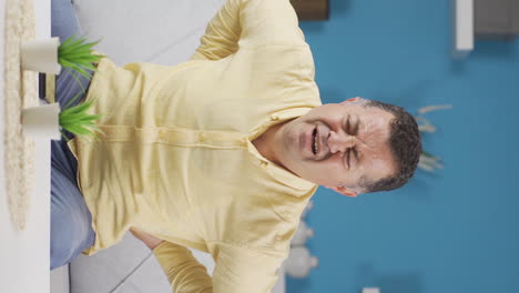 Vertical-video-of-Old-man-with-low-back-pain-with-hernia.